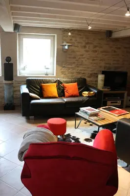 Coin salon dans l'établissement Gite Le Meix Chapeau
