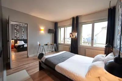Un ou plusieurs lits dans un hébergement de l'établissement L'aparthoteL LhL
