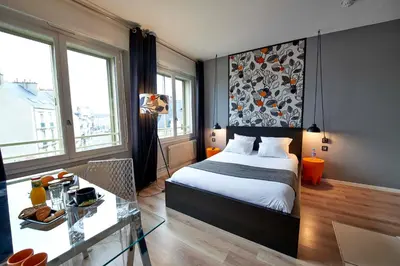 Un ou plusieurs lits dans un hébergement de l'établissement L'aparthoteL LhL