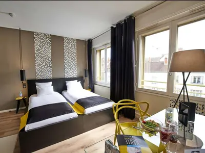 Un ou plusieurs lits dans un hébergement de l'établissement L'aparthoteL LhL