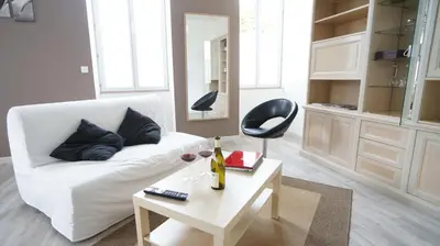 Coin salon dans l'établissement Le Corton de Beaune, appartement classé 3 étoiles