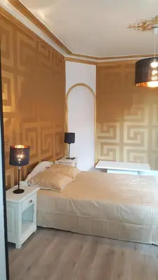 Un ou plusieurs lits dans un hébergement de l'établissement Luxury Suite Lilas