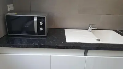 Cuisine ou kitchenette dans l'établissement Luxury Suite Lilas
