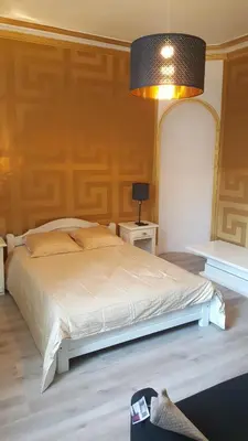 Un ou plusieurs lits dans un hébergement de l'établissement Luxury Suite Lilas