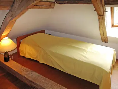 Un ou plusieurs lits dans un hébergement de l'établissement Holiday Home Premier gîte de Bouton by Interhome