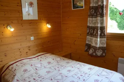 Un ou plusieurs lits dans un hébergement de l'établissement chalet des planchettes