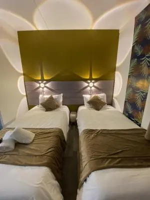 Un ou plusieurs lits dans un hébergement de l'établissement FASTHOTEL A Dijon