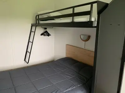 Un ou plusieurs lits dans un hébergement de l'établissement Hotel Macon la Salle
