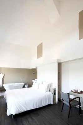 Un ou plusieurs lits dans un hébergement de l'établissement Auberge Du Paradis