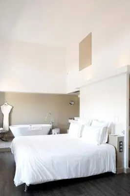 Un ou plusieurs lits dans un hébergement de l'établissement Auberge Du Paradis