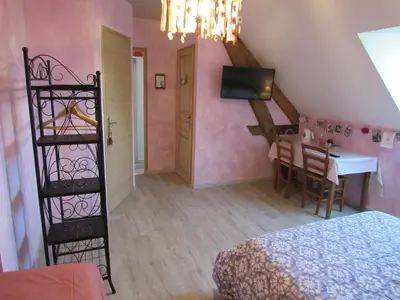 Un ou plusieurs lits dans un hébergement de l'établissement Chambres d'hôtes Les Arondelles