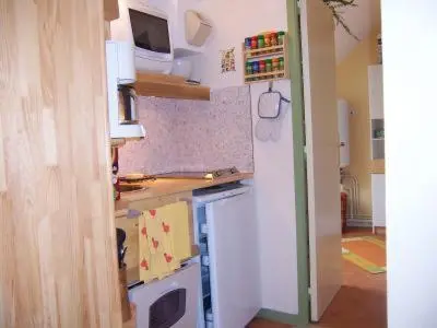 Cuisine ou kitchenette dans l'établissement La maison de poupet