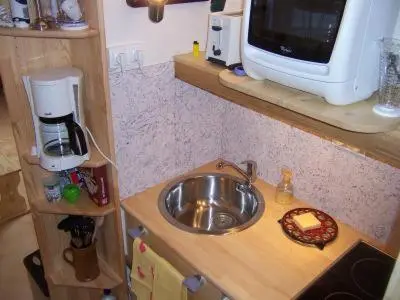 Cuisine ou kitchenette dans l'établissement La maison de poupet