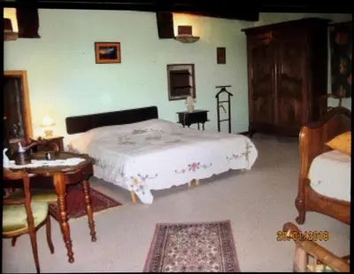 Un ou plusieurs lits dans un hébergement de l'établissement CHAMBRES D' HOTES LA LISON