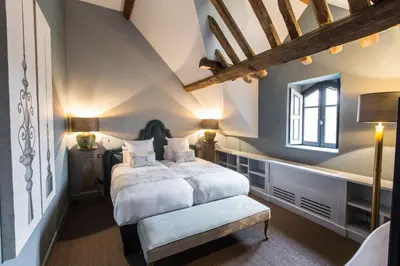 Un ou plusieurs lits dans un hébergement de l'établissement Domaine de Rymska & Spa - Relais & Châteaux