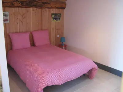 Un ou plusieurs lits dans un hébergement de l'établissement Gîte chez karine et roland