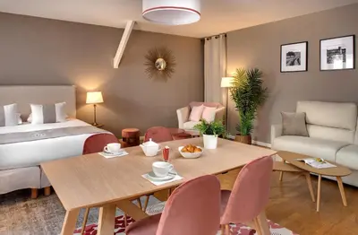 Coin salon dans l'établissement Appartements des Ducs