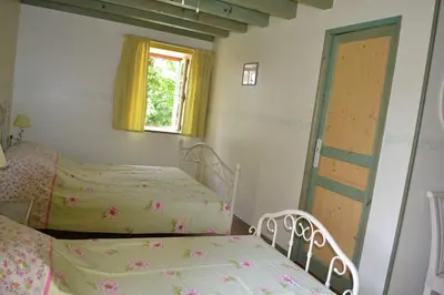 Un ou plusieurs lits dans un hébergement de l'établissement Chambres d'Hôtes Le Moulin à Epices