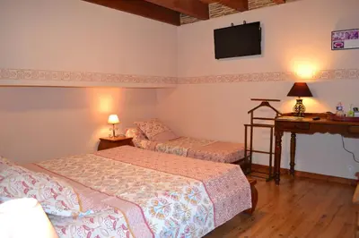 Un ou plusieurs lits dans un hébergement de l'établissement Chambres d'Hôtes Le Moulin à Epices