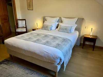Un ou plusieurs lits dans un hébergement de l'établissement Hotel Le Manasses