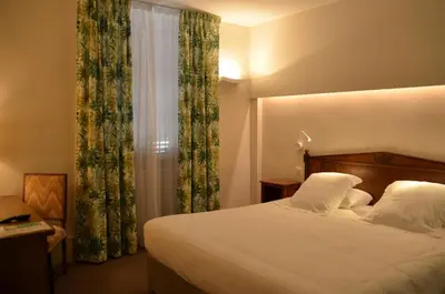 Un ou plusieurs lits dans un hébergement de l'établissement Hotel de Bourgogne