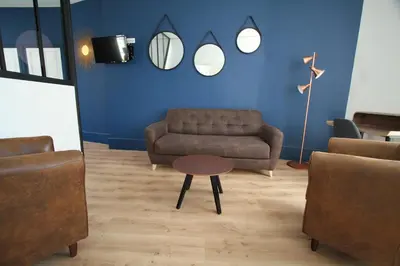 Coin salon dans l'établissement Le clos des etoiles