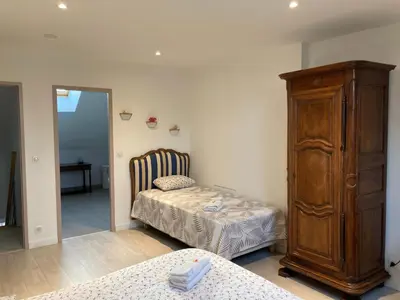 Un ou plusieurs lits dans un hébergement de l'établissement Chambres d'hotes Maison Gille