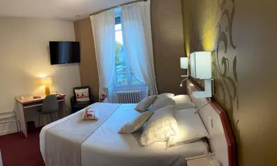 Un ou plusieurs lits dans un hébergement de l'établissement Hôtel Gambetta