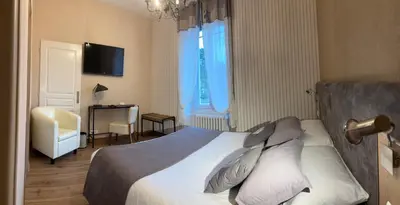 Un ou plusieurs lits dans un hébergement de l'établissement Hôtel Gambetta