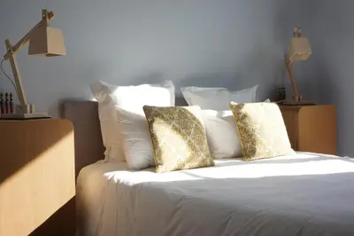 Un ou plusieurs lits dans un hébergement de l'établissement Hôtel Courtille de Solutré