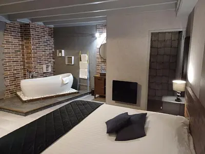 Un ou plusieurs lits dans un hébergement de l'établissement Domaine de Vandenesse Et Spa