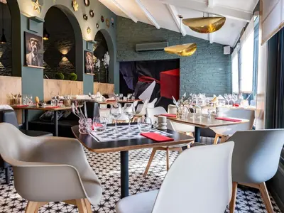 Coin salon dans l'établissement ibis Macon Sud Crêches