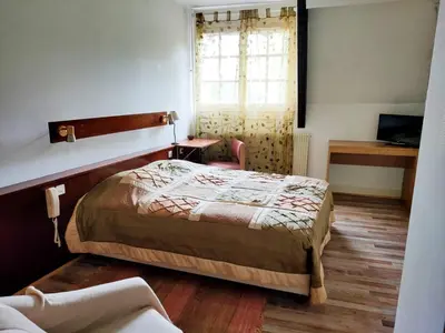 Un ou plusieurs lits dans un hébergement de l'établissement Auberge du val d’ouche