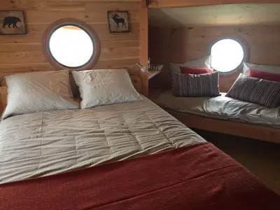 Un ou plusieurs lits dans un hébergement de l'établissement cabane flottante Millenium