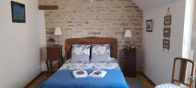 Un ou plusieurs lits dans un hébergement de l'établissement La Maison de l'Escargot