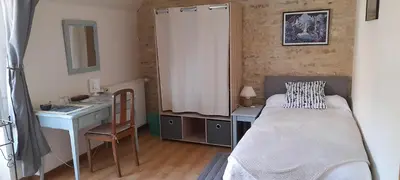 Un ou plusieurs lits dans un hébergement de l'établissement La Maison de l'Escargot