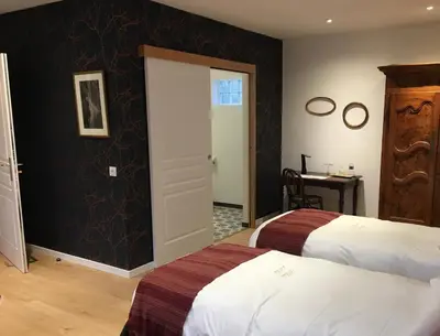 Un ou plusieurs lits dans un hébergement de l'établissement Chambres d'hôtes Le Relais de la Perle