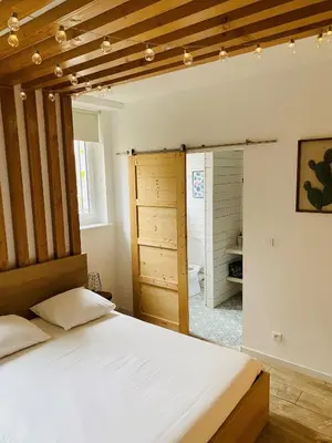 Un ou plusieurs lits dans un hébergement de l'établissement Suite 24 Appart'hôtel-3 étoiles