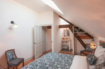 Un ou plusieurs lits dans un hébergement de l'établissement Chai du Chateau de Morteuil