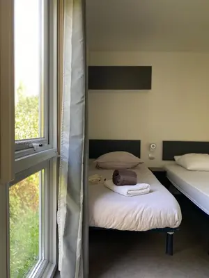 Un ou plusieurs lits dans un hébergement de l'établissement Les Lodges