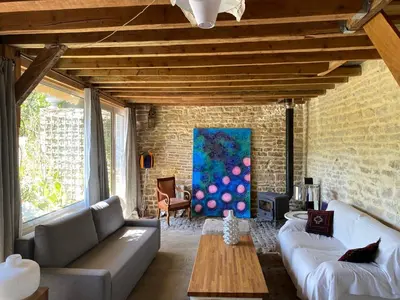 Coin salon dans l'établissement Maison d'hôtes des Perrières
