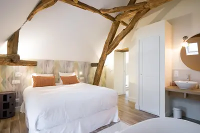 Un ou plusieurs lits dans un hébergement de l'établissement La Maison Deveney-Mars