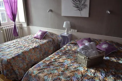 Un ou plusieurs lits dans un hébergement de l'établissement Hôtel du Commerce