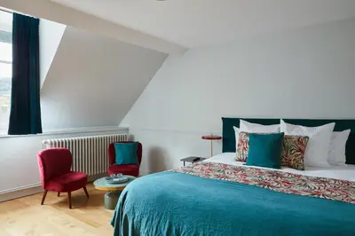 Un ou plusieurs lits dans un hébergement de l'établissement La Closerie des Capucines