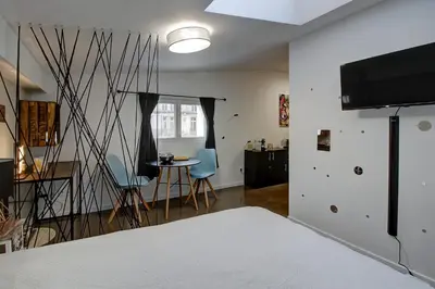 Un ou plusieurs lits dans un hébergement de l'établissement STUDIO LE CHOUETTE