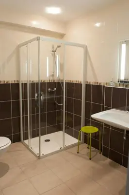 Salle de bains dans l'établissement Le Jardin de la Reyssouze