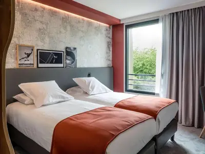 Un ou plusieurs lits dans un hébergement de l'établissement BEST WESTERN HOTEL DIJON QUETIGNY