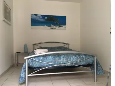 Un ou plusieurs lits dans un hébergement de l'établissement Chambre du verger