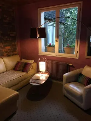 Coin salon dans l'établissement Hotel Victor Hugo