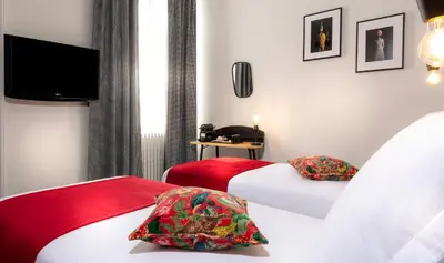 Un ou plusieurs lits dans un hébergement de l'établissement Hotel Saint Regis